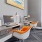 a room with a desk and computer