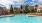 a pool with chairs around it