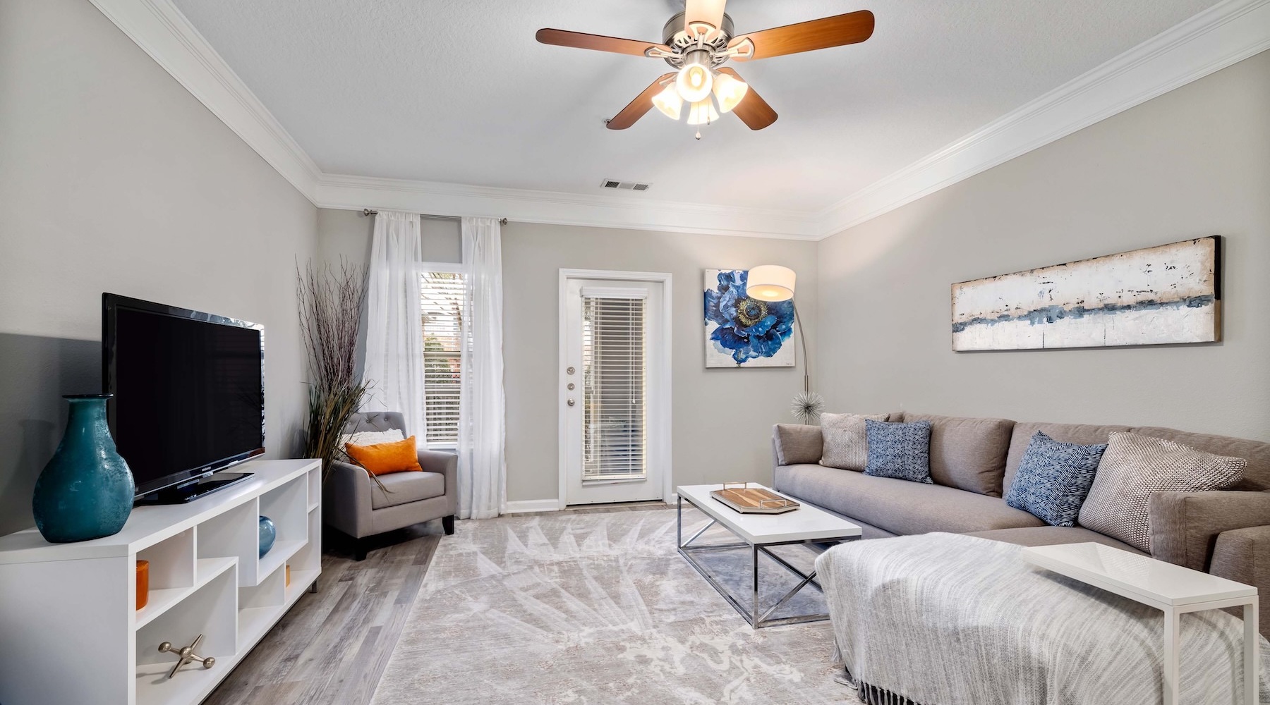 Relax and unwind in stylish living areas a living room with a couch, tv and glass door