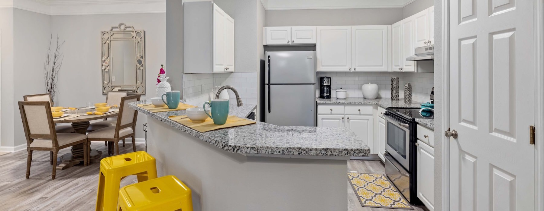 a kitchen with white cabinets