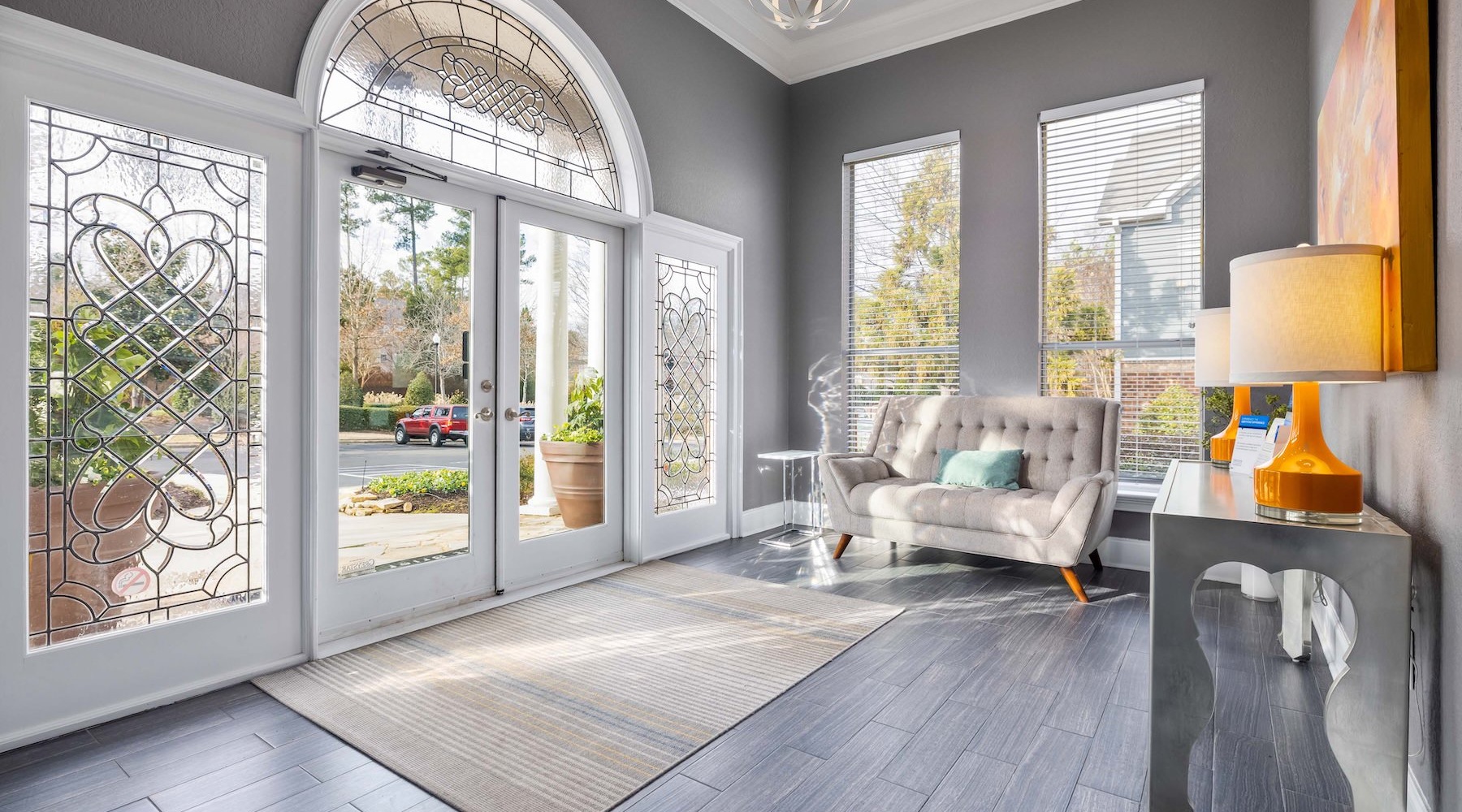 Find your perfect fit at Braxton at Brier Creek a room with a couch and large glass door