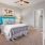 a bedroom with a bed and a fan