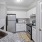 a kitchen with white cabinets