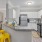 a kitchen with white cabinets