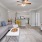 a living room with a tv and couches