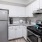 a kitchen with white cabinets