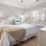 a bedroom with a bed and a fan