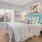 a bedroom with a fan and a bed