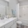 a bathroom with a tub sink and toilet