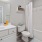a bathroom with a tub toilet and sink