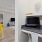 a room with a desk and computer