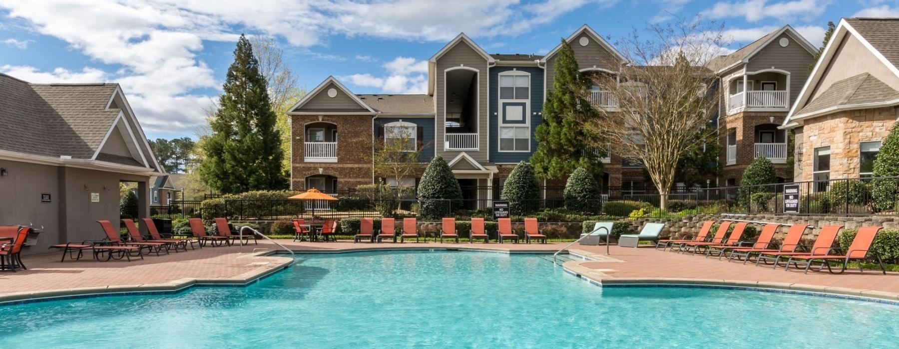 a pool with chairs around it