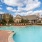 a swimming pool with chairs around it
